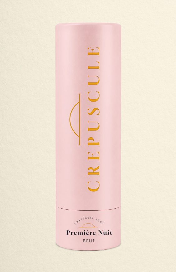Coffret champagne premium Crépuscule avec tube rose minimaliste et détails dorés inspirés du luxe et de la parfumerie.