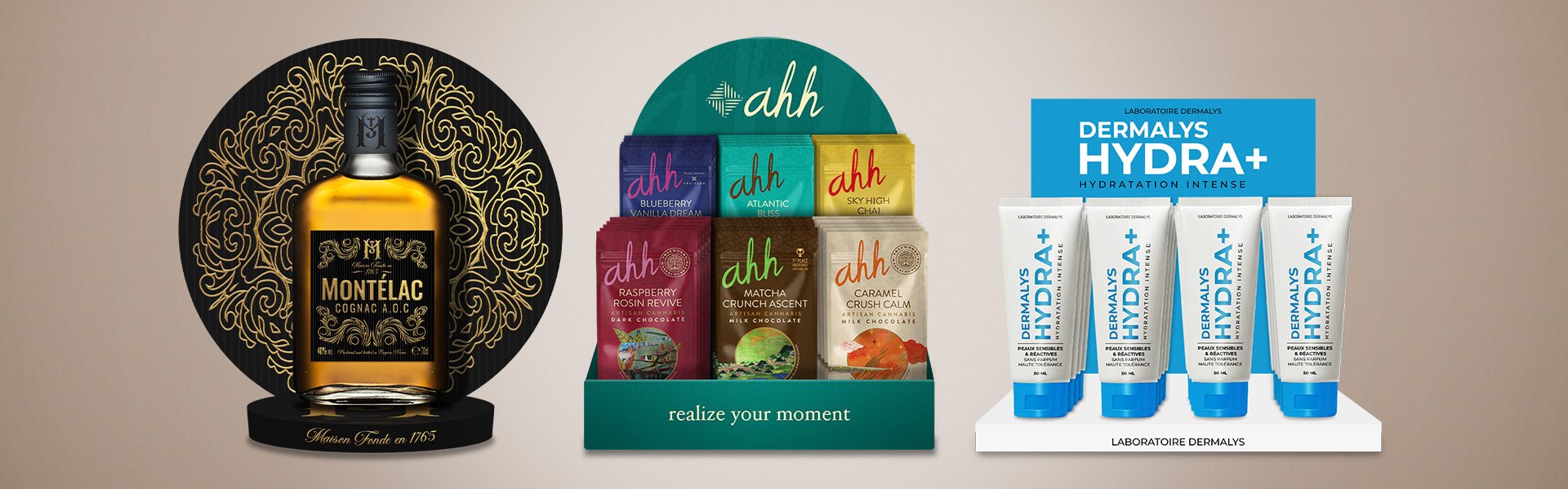 PLV de comptoir en carton présentant une bouteille premium, des chocolats et des soins dermocosmétiques