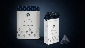 Conception de packaging thé haut de gamme Maison Folia comprenant une boîte en céramique blanche et un étui en carton avec sachets pyramides.